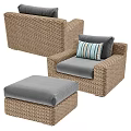 Comfortable Wicker Outdoor Sofa with Soft Gray Cushions and Striped Pillows