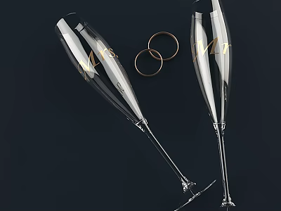 Elegant Champagne Glasses With Gold Lettering And Gold Rings On Dark Background 3d model