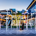 Outdoor Photo Check-in Spot With Artistic Light Installations And Modern Plaza Background