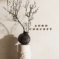 Black Ceramic Vase with Dried Branches on White Pedestal Against Neutral Wall AUDO CONCEPT Decor