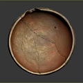 Ancient Ceramic Bowl Sculpture With Cracked Orange Interior And Decorative Patterns