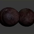 Three Dark Red Round Textured Fruits With Orange Tops On Dark Background