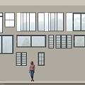 Various Types of Glass Windows Arranged on Wall with Person Standing