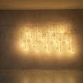 Star Shaped Hanging Decorative Lights Illuminated In Modern Room With Concrete Wall