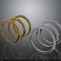 Stacked Gold And Silver Bracelets With Inlaid Decorations On Dark Background With Reflections
