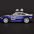 Porsche 953 Blue And White Sports Car With Roof Mounted Equipment And Racing Stripes