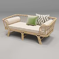 Cozy Wicker Sofa with Beige Cushions and Green Geometric Pattern Pillows