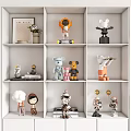 Decorative Dolls Displayed On White Shelves With Various Designs Small Ornaments And Books