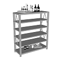 Open Metal Frame Storage Cabinet With Glass Shelves And Decorative Items