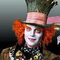 Mad Hatter Movie Character With Orange Hair Tall Hat White Makeup And Green Eyes