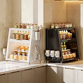 Modern Open Kitchen Cabinets White and Black with Glass Jars Spices and Mugs on Countertop