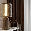 Modern Table Lamps With Textured Shade And Glass Cover On Marble Surface And Metal Stand