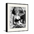 Vintage Black and White Female Portrait in Kitchen with Brick Wall Utensils and Countertop