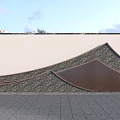 Modern Outdoor Feature Wall With Curved Wooden Slats And Natural Stone Texture