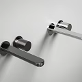 Two Black Wall Mounted Faucets Sleek Modern Metal Design Installed On Light Colored Wall