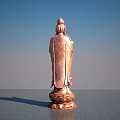 Standing Copper Buddha Sculpture With Lotus Base And Blue Sky Background