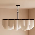 Modern U Shaped Chandelier With White Ribbed Shades In Light Colored Interior Room