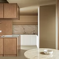 Modern Open Concept Dining and Living Area With Wooden Cabinets Marble Countertop and Green Plants