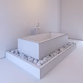 White Freestanding Bathtub On Platform Surrounded By Pebbles With Modern Faucet