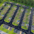 Aerial View Of Parking Lot With Neatly Arranged Spaces Trees And Driveways