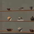 Ceramic Vessels Displayed on Wooden Shelves Against Gray Wall with Rustic Natural Shapes and Colors