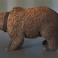 Brown Bear Wearing Collar Standing On Gray Surface In Studio
