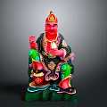 Traditional Deity Statue With Red Face Golden Crown Green Robe And Decorative Base