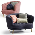 Blush Pink and Navy Blue Velvet Armchairs with Patterned Pillows and Wooden Legs
