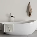 White Freestanding Bathtub With Faucet Towel And Hanging Towel In Modern Bathroom
