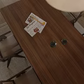 Modern Living And Dining Room Interior With Wooden Elements Beige Walls And Simple Chair
