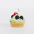 Freshly Baked Cupcake With Green Frosting Topped With Blackberries And Strawberry