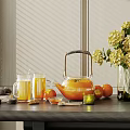 Stylish Teapot And Glass Cups With Fresh Fruits Yellow Flowers On Table By Window Blinds