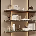 Elegant Decorative Ornament Set Displayed on Tiered Shelves with Books Sculptures Vases and Candle Holders