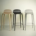 Two Modern Bar Stools With Wooden And Metal Frames Against Dark Wall And Light Floor