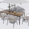 Outdoor Garden Wooden Table And Rattan Chairs Set With White Umbrella And Small Plant