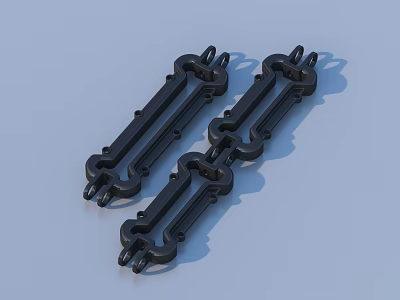 Three Black Mechanical Parts With Intricate Design On Light Blue Surface 3d model