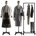 Mannequins Displaying Plaid Coat Gray Top Brown Skirt Gray Coat With Belt Black Bag Hanging Coats And Boots