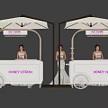 HONEY CITRON Photo Check in Spot With White Food Carts Golden Frames Umbrellas And Women In White Dresses