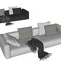 White and Black Two-Seater Sofa with Pillows and Blanket Living Room Interior Design
