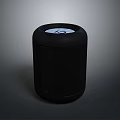 Black Cylindrical Computer Device With Mesh Surface And Top Circular Panel Design