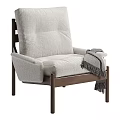 Plush White Fabric Accent Chair with Wooden Frame and Gray Fringed Throw in Modern Design