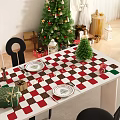 Festive Christmas Restaurant Dining Table Setup With Checkered Tablecloth Gifts And Small Trees
