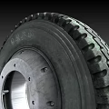 Heavy Duty Tire With Black Rubber Construction And Metal Rim Tread Pattern