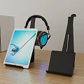 Modern Iron Stand For Headphones And Tablet On Wooden Table With Books