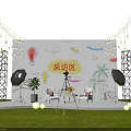 Interview Area Setup On Grass Floor With Hand Painted Backdrop String Lights And Camera Tripod