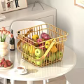 Assorted Fresh Fruits in Golden Wire Basket on White Table with Fresh Strawberries