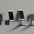 Different Designed Wall Mounted Phone Holders With White Phones On Gray Wall
