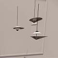 Modern Disc Pendant Lights With Warm Glow Hanging In Minimalist Gray Interior