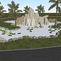 Rockery Stones With Waterfall In Garden Pond Surrounded By Water Lilies And Palm Trees