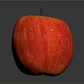 Shiny Red Apple With Yellow Spots And Brown Stem On Black Surface Gray Background